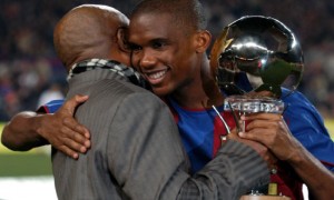 Barcelona's Samuel Eto'o recieves his African Footballer of the Year Award from his father before the game against Real Mallorca