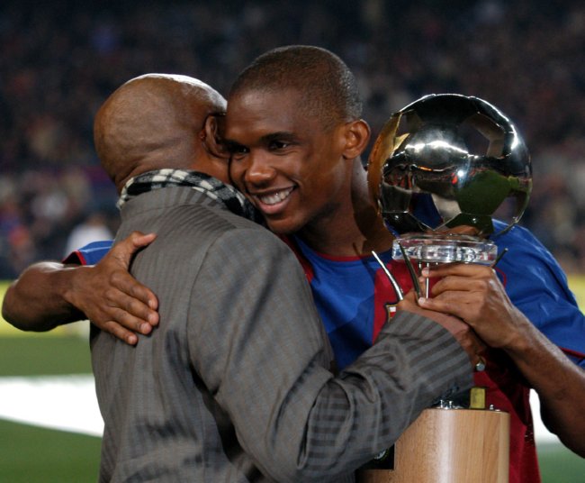 Barcelona's Samuel Eto'o recieves his African Footballer of the Year Award from his father before the game against Real Mallorca